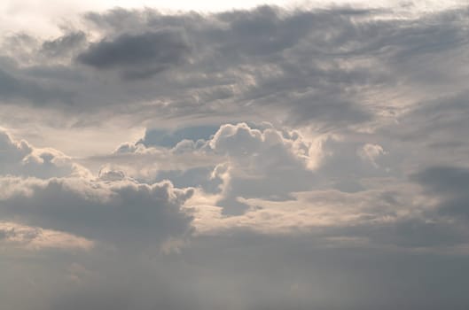 Dramatic clouds with blue sky background before sunset. The softness of the clouds and the brightness of the sky. Concept idea of Imaginative clouds and sky, Nature abstract composition, use it as your Wallpaper, Poster and Space for text, Selective focus.