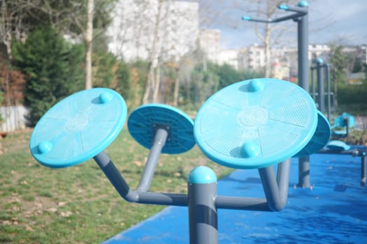 A modern exercise station designed for conducting outdoor workouts conveniently located in a park