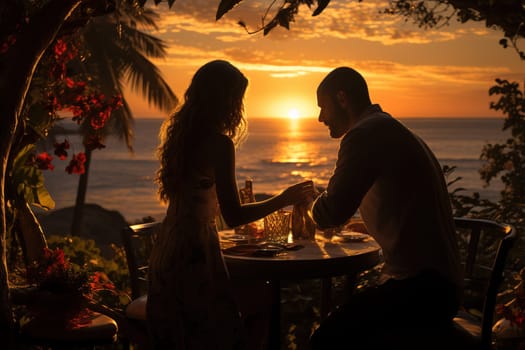 Romantic couple having dinner at sunset by the sea. High quality photo