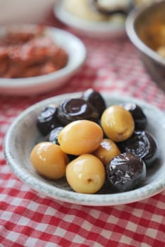 Collection of black and green olives with leaves