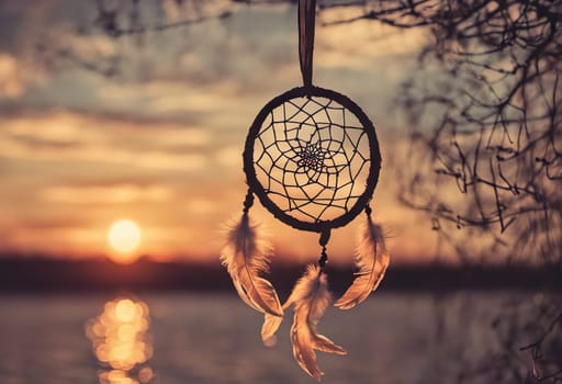 Dreamcatcher sunset sky, boho chic, ethnic amulet symbol Indigenous Peoples Day and Native Americans Day