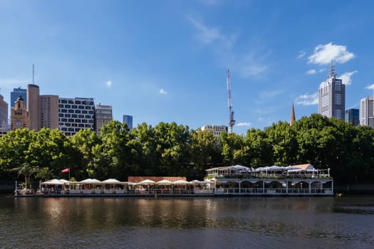 MELBOURNE, AUSTRALIA - JANUARY 08, 2025: Views towards Melbourne CBD and Princes Bridge along the Yarra River from Southbank in Melbourne, Victoria, Australia