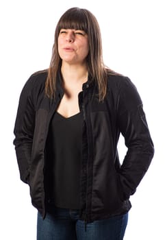 Portrait of a forty something woman, wearing a motocycle jacket, holding in a laugh, isolated against a white background