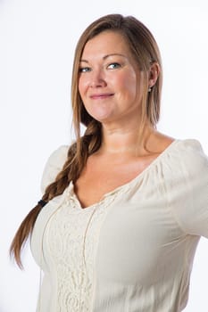 Portrait of a forty something woman, wearing casual clothes, with a smile, isolated against a white background