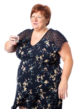 Fifty something woman holding a skull shape shooter of vodka