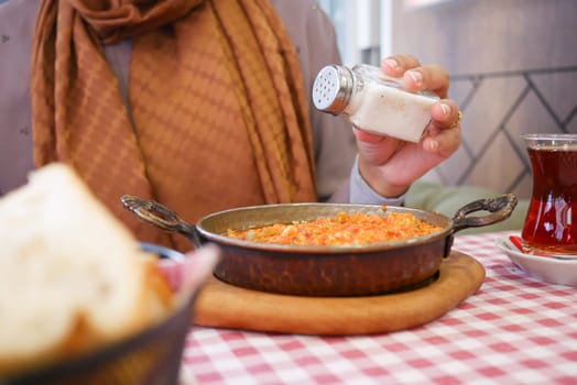 Turkish Menemen omelet in a frying pan.
