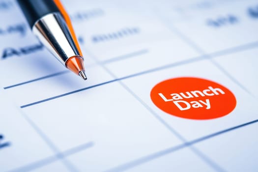 This close-up image shows a calendar marked with a red circle indicating Launch Day, emphasizing the importance of the date for planning and organization.