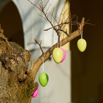 Tree decorated with Easter eggs during the Easter holidays in the city center of Berlin, Germany