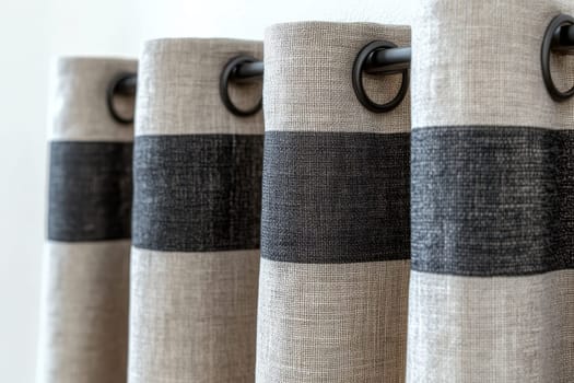 curtain rod holding gray curtains with grommets..