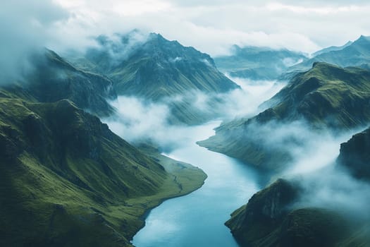 Fog blankets the mountains as a tranquil river weaves between lush valleys, creating a serene and mysterious atmosphere.