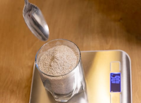 Coarse rye flour measured on the small electronic scale