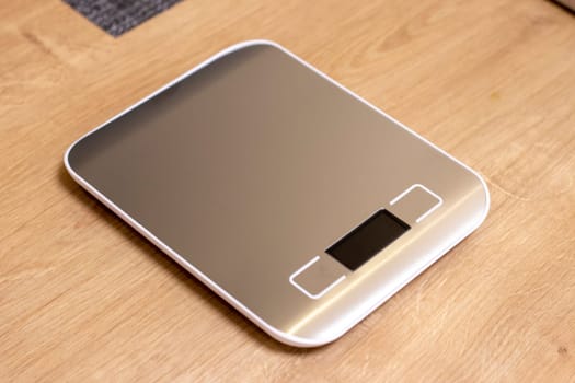 Small electronic scale on the kitchen counter top