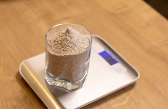 Coarse rye flour measured on the small electronic scale