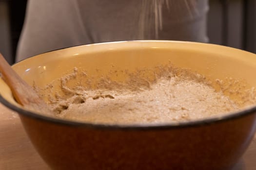 Close up shot of the dough in the bawl on the kitchen counter top