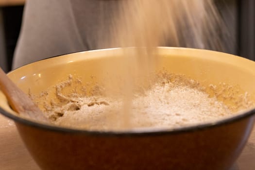 Close up shot of the dough in the bawl on the kitchen counter top