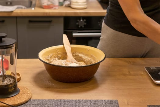 Close up shot of the dough in the bawl on the kitchen counter top