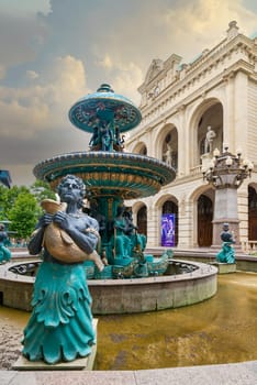 Ganga, Azerbaijan - May 13, 2024: A fountain featuring sculptures, situated outside the Ganja State Philharmonic Hall