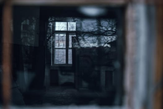 old window in an ancient brick wall in an abandoned farm barn. High quality photo