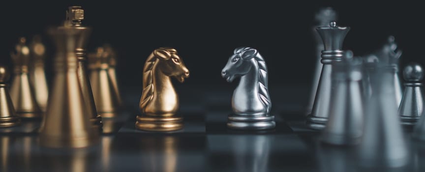 Gold and silver chess pieces in chess board game for business comparison. Leadership concepts, human resource management concepts.