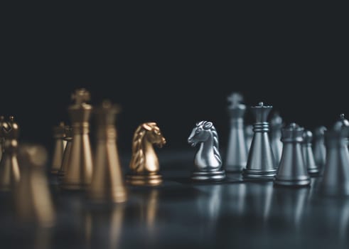 Gold and silver chess pieces in chess board game for business comparison. Leadership concepts, human resource management concepts.