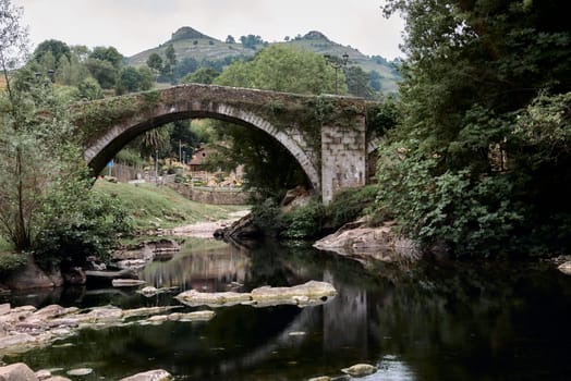 Puente Mayor de Lierganes, Cantabria, mountain scenery.Mediaeval, ancient, river, cloudy vegetation unforgiving empty space