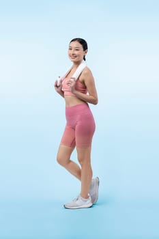 Full body asian woman in sportswear portrait, smiling and posing cheerful gesture. Workout training with attractive girl engage in her pursuit of healthy lifestyle. Isolated background Vigorous