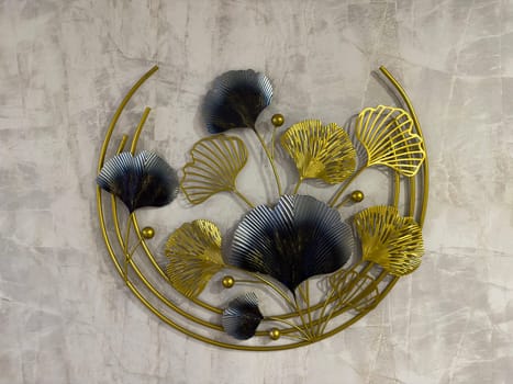 Beautiful wall decoration showcasing intricate metal leaves and flowers in gold and silver tones, adding a touch of elegance to modern interior spaces. Perfect for enhancing home decor.