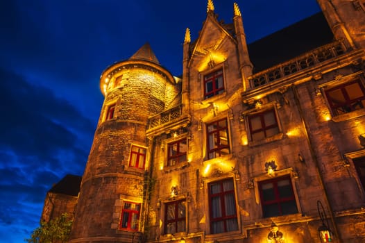 walls of the old medieval castle illuminated at night in French village in Ba Na Hills Park in Da Nang in Vietnam