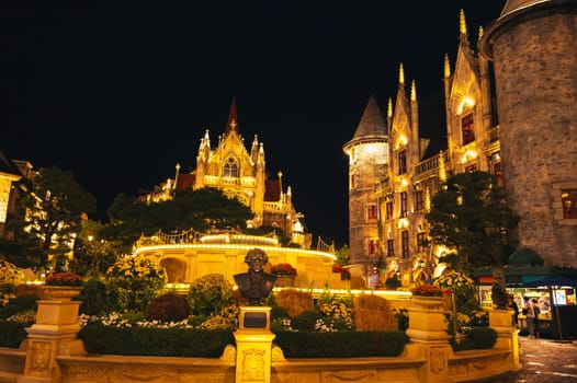 Catholic Cathedral in the central square of the medieval city in Ba Na Hills Park in Da Nang in Vietnam at night