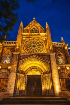 medieval Catholic cathedral in European style in French village in Ba Na Hills Park in Da Nang in Vietnam at night