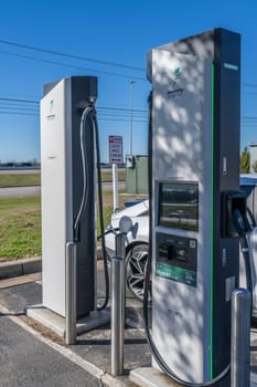 Georgetown, TX - 11 January 2025: Hyundai electric car connected to DC high speed charger at Electrify America public charging unit