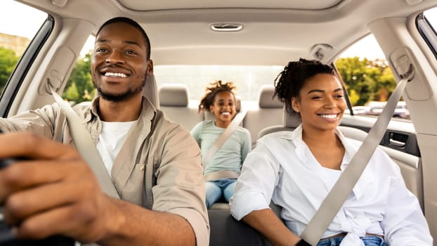 Car Sales. Cheerful African American Family Riding New Automobile Traveling On Vacation. Happy Parents And Daughter Enjoying Road Trip In Summer. Transportation And Vehicle Purchase