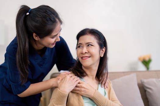 Empathetic caregiver engaging with elderly woman, fostering a positive connection and providing emotional support in a soothing home environment.
