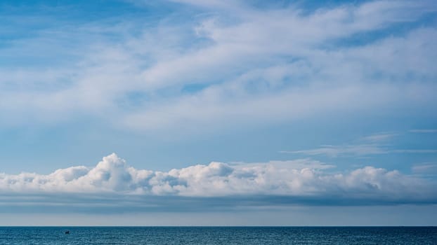 Atmosphere panorama real photo beautiful summer white cloud clear blue sky horizon line calm empty sea. Concept paradise life. Design relax wallpaper background. More tone format collection in stock.