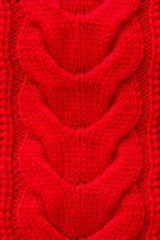 Red knitted winter sweater Background texture