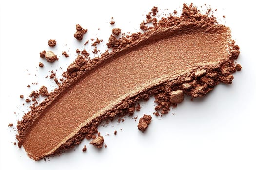 Scattering of bronzer or brown eyeshadow for face on white background, makeup concept