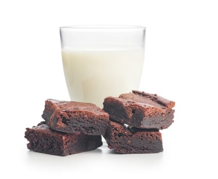 Homemade chocolate brownies and milk in glass isolated on a white background.