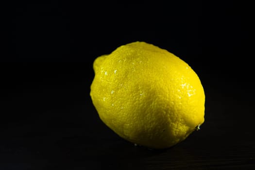 fruit lemon on black background. High quality photo