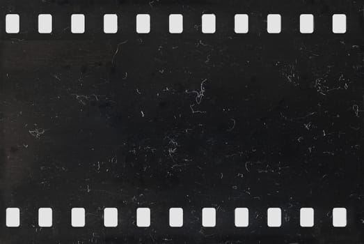 Strip of old celluloid film with dust and scratches - negative