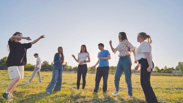 A group of funny friends dancing in the street