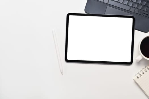 Digital tablet, laptop, notebook and coffee cup on white background. Top view ,flat lay.