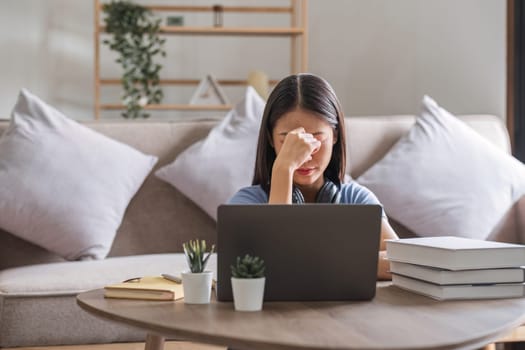 Bored woman studying at home. Student learning and working at home..