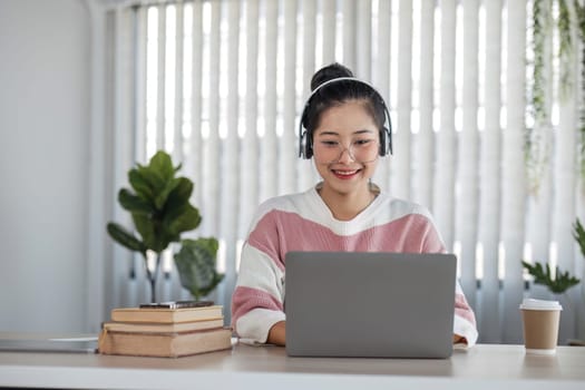 Asian girl student online learning class study online video call teacher, Happy asian girl learn language online with computer laptop.