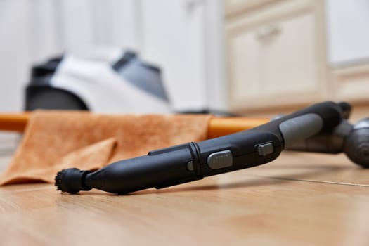 Professional cleaning steam generator on the kitchen floor. Home cleaning.