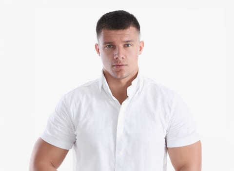 Young successful businessman on a white background in a shirt