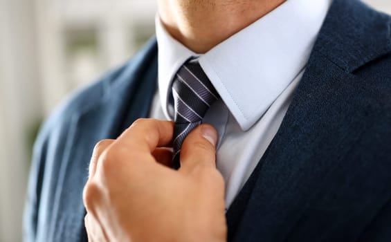 Male arm in blue suit set tie closeup. White collar management job serious move secretary student luxury formal interview executive agent marriage store corporate elegance employment preparation