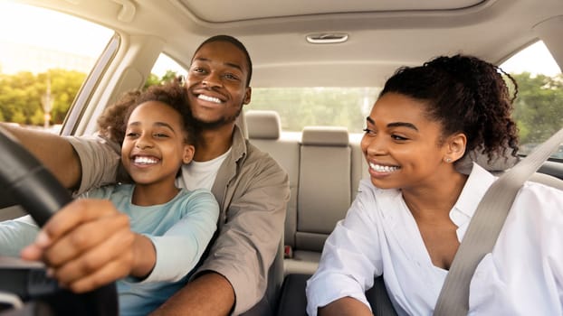 African American Father Teaching His Daughter To Drive Driving The Car Together. Happy Family Riding New Automobile In City, Having Fun Traveling By Auto. Vehicle Transportation