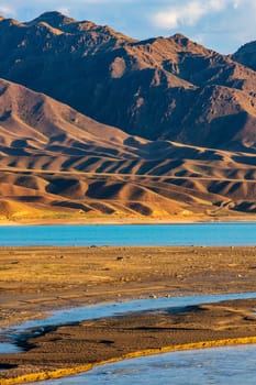 Vertical scenic landscape of central asia with amazing combination of dry steppe climate and artificial reservoir bartogay in almaty region of kazakhstan.