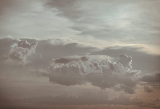 Dramatic clouds with blue sky background before sunset. The softness of the clouds and the brightness of the sky. Concept idea of Imaginative clouds and sky, Nature abstract composition, use it as your Wallpaper, Poster and Space for text, Selective focus.