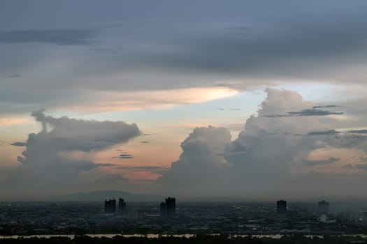 Bangkok, Thailand - 13 Oct, 2024 - Aerial view of Bangkok city and beautiful clouds in sky background with the Chao Phraya River before sunset. use it as your wallpaper, poster and Space for text, Selective focus.